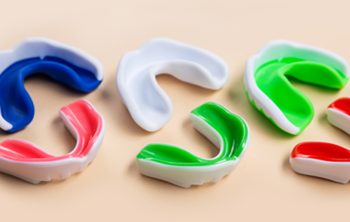 Safe Use of Custom Mouth Guards During Sports: Your Dentist’s Tips